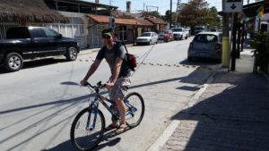 Tom Pingel on a bicycle with a laser scanner.